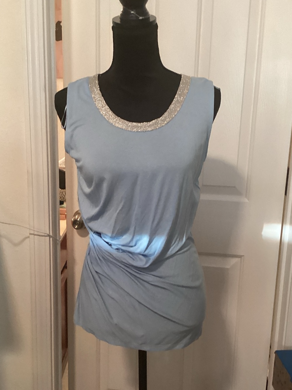 Sleeveless Light Blue Top with Embellished Neckline